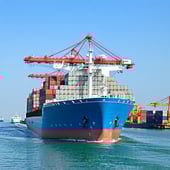 A cargo ship engaged in EU export and import (Intrastat reporting)